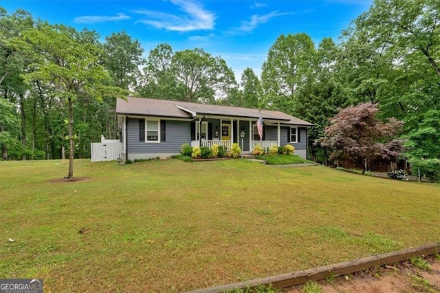 single story home with a porch and a front lawn