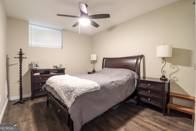 bedroom featuring dark wood-type flooring, baseboards, and ceiling fan