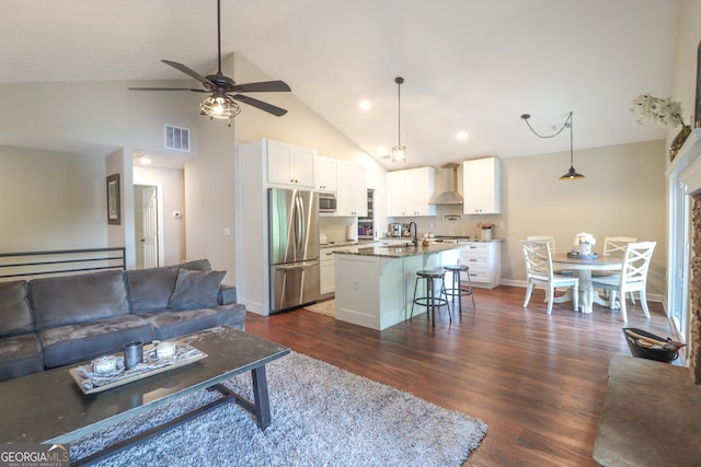 living area featuring a ceiling fan, dark wood finished floors, baseboards, high vaulted ceiling, and recessed lighting