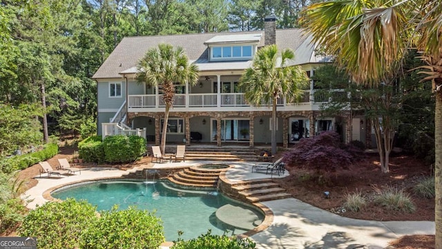 1221 Cosby Cir, Greensboro, GA 30642 - rear view of property featuring stairway, a patio, an in-ground hot tub, an outdoor pool, and a chimney
