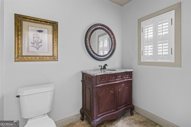 1221 Cosby Cir, Greensboro, GA 30642 - bathroom with baseboards, toilet, and vanity