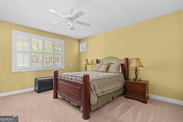 1221 Cosby Cir, Greensboro, GA 30642 - bedroom with light carpet, baseboards, and ceiling fan