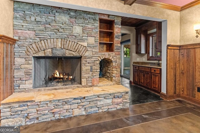 1221 Cosby Cir, Greensboro, GA 30642 - detailed view of finished concrete flooring, ornamental molding, an outdoor stone fireplace, and wood walls