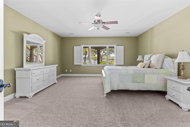 1221 Cosby Cir, Greensboro, GA 30642 - bedroom featuring multiple windows, light colored carpet, and baseboards