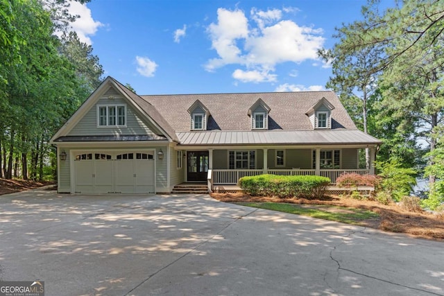 1221 Cosby Cir, Greensboro, GA 30642 - view of front of home with a standing seam roof, covered porch, concrete driveway, and metal roof