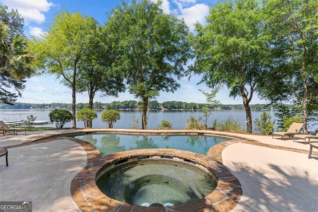 1221 Cosby Cir, Greensboro, GA 30642 - view of pool featuring a patio area, a water view, and a pool with connected hot tub