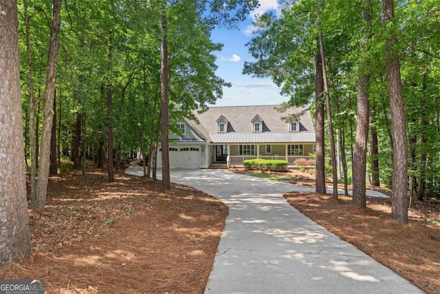 1221 Cosby Cir, Greensboro, GA 30642 - new england style home with a porch, concrete driveway, a garage, metal roof, and a standing seam roof