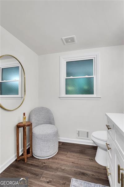 529 Greystone Trl, Marietta, GA 30068 - bathroom featuring vanity, wood finished floors, toilet, baseboards, and plenty of natural light