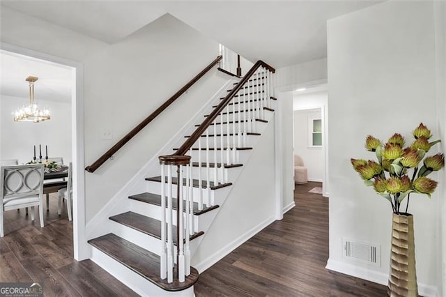 529 Greystone Trl, Marietta, GA 30068 - stairs featuring wood finished floors, a chandelier, and baseboards