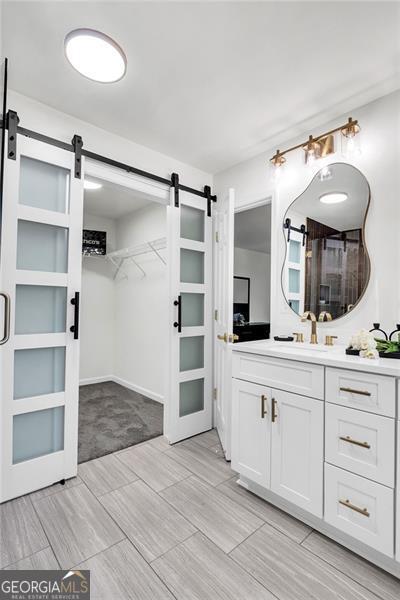 529 Greystone Trl, Marietta, GA 30068 - full bathroom with vanity and a walk in closet