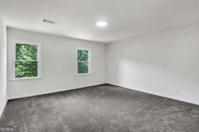 529 Greystone Trl, Marietta, GA 30068 - empty room with healthy amount of natural light, baseboards, and dark colored carpet