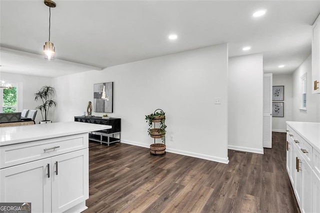 529 Greystone Trl, Marietta, GA 30068 - kitchen featuring light countertops, dark wood-style flooring, white cabinetry, pendant lighting, and recessed lighting