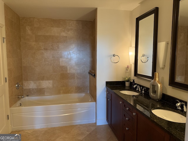 bathroom with tile patterned flooring, double vanity, and bathtub / shower combination