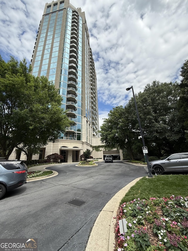 view of property with uncovered parking