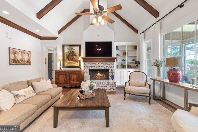 11660 Crabapple Rd, Roswell, GA 30075 - living area with high vaulted ceiling, wood finished floors, ceiling fan, beam ceiling, and a brick fireplace