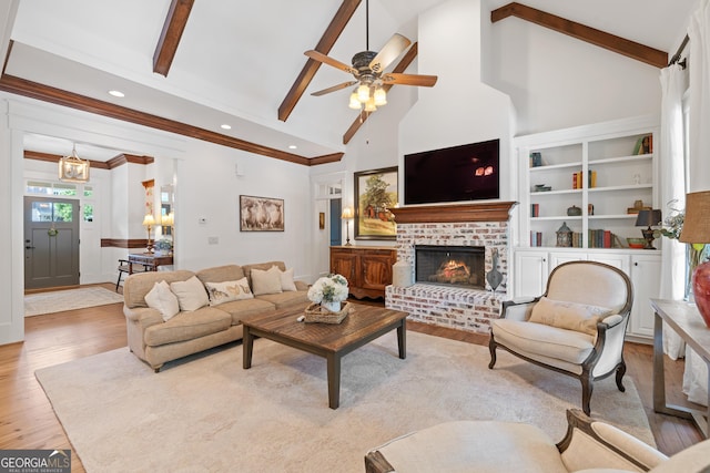 11660 Crabapple Rd, Roswell, GA 30075 - living area with wood finished floors, a fireplace, high vaulted ceiling, a ceiling fan, and beamed ceiling