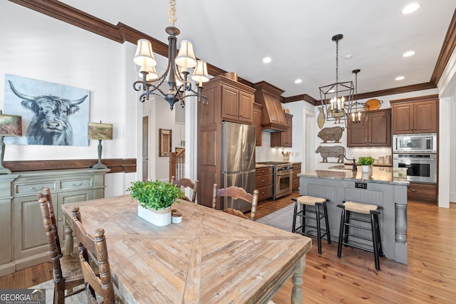 11660 Crabapple Rd, Roswell, GA 30075 - dining space with a chandelier, ornamental molding, recessed lighting, and light wood-style floors