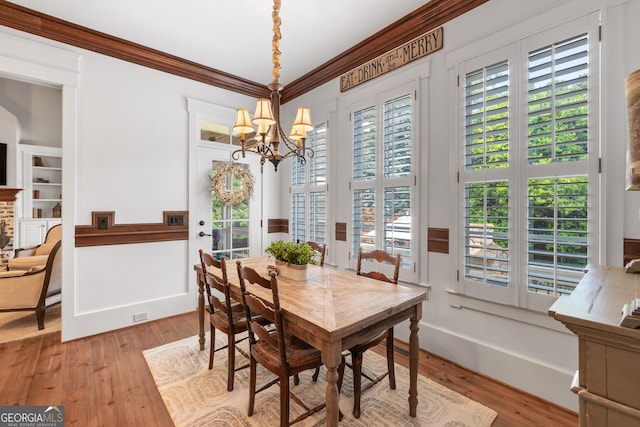 11660 Crabapple Rd, Roswell, GA 30075 - dining space with a chandelier, light wood-type flooring, and ornamental molding