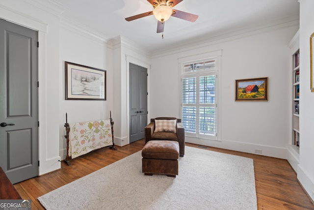 11660 Crabapple Rd, Roswell, GA 30075 - living area with crown molding, ceiling fan, and wood finished floors