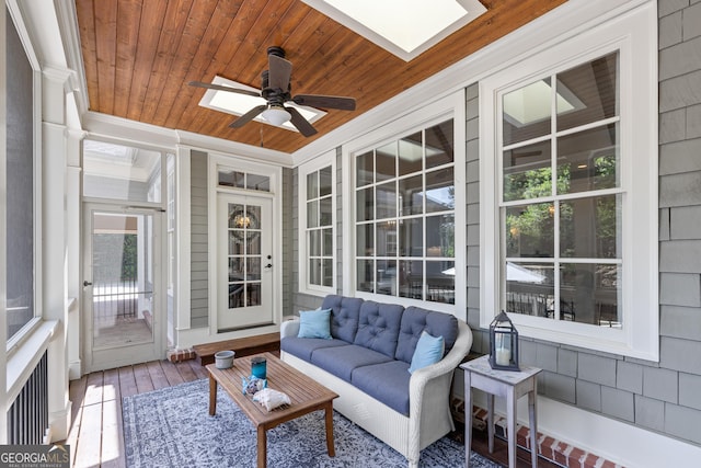 11660 Crabapple Rd, Roswell, GA 30075 - sunroom with ceiling fan, a skylight, wooden ceiling, outdoor lounge area, and ornamental molding
