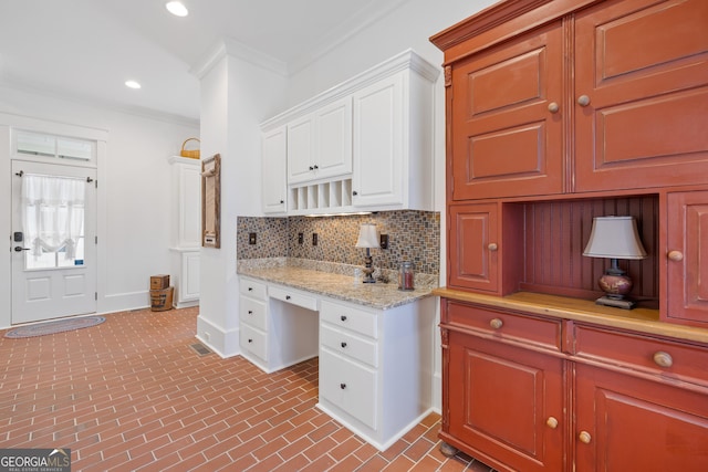 11660 Crabapple Rd, Roswell, GA 30075 - kitchen with backsplash, brick patterned floors, white cabinetry, ornamental molding, and recessed lighting