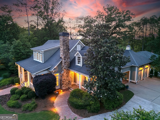 11660 Crabapple Rd, Roswell, GA 30075 - view of front facade featuring driveway and a chimney