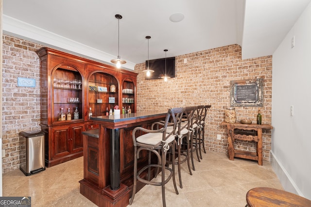 11660 Crabapple Rd, Roswell, GA 30075 - indoor dry bar featuring light tile patterned floors, decorative light fixtures, and brick wall