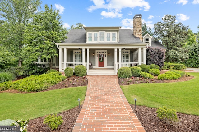 11660 Crabapple Rd, Roswell, GA 30075 - view of front of home with a chimney, a front lawn, covered porch, and a ceiling fan