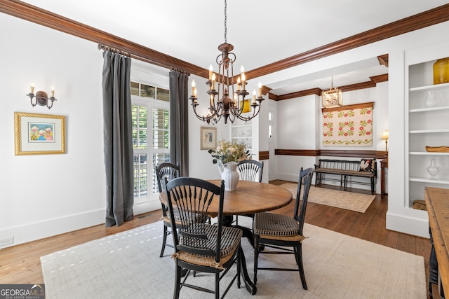 11660 Crabapple Rd, Roswell, GA 30075 - dining area with a chandelier, ornamental molding, and wood finished floors