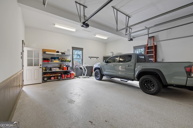 11660 Crabapple Rd, Roswell, GA 30075 - garage with a garage door opener and a wainscoted wall
