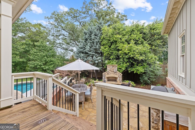 11660 Crabapple Rd, Roswell, GA 30075 - wooden terrace with a stone fireplace and a patio