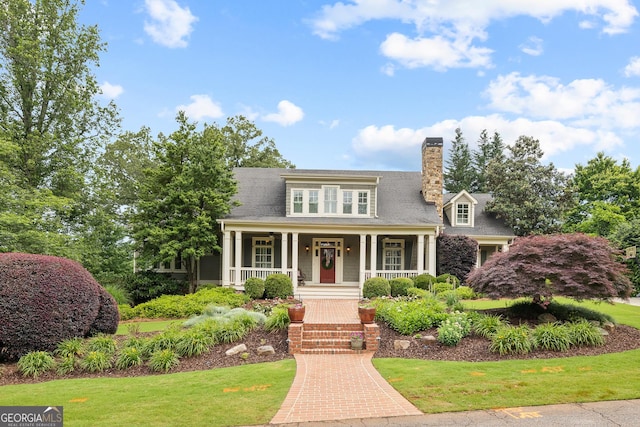 11660 Crabapple Rd, Roswell, GA 30075 - view of front of property featuring covered porch, a front lawn, and a chimney