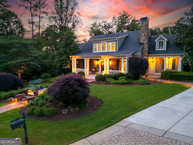 11660 Crabapple Rd, Roswell, GA 30075 - view of front of property with covered porch, a chimney, and a front yard
