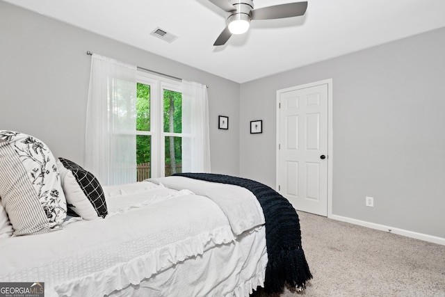bedroom with carpet flooring, baseboards, and a ceiling fan