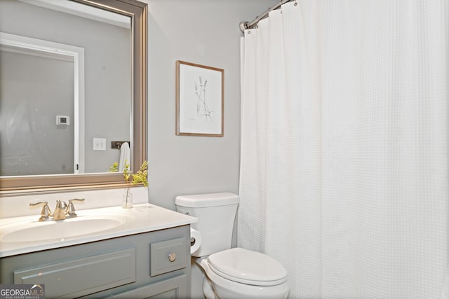 bathroom with toilet and vanity