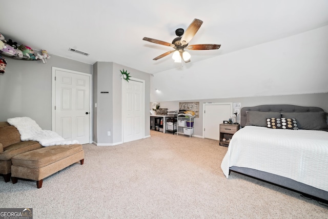 carpeted bedroom featuring lofted ceiling, baseboards, and ceiling fan
