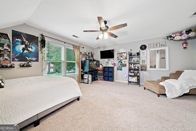 carpeted bedroom with a ceiling fan, baseboards, and lofted ceiling