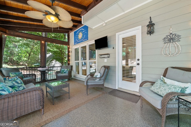 sunroom with ceiling fan, outdoor lounge area, and beam ceiling