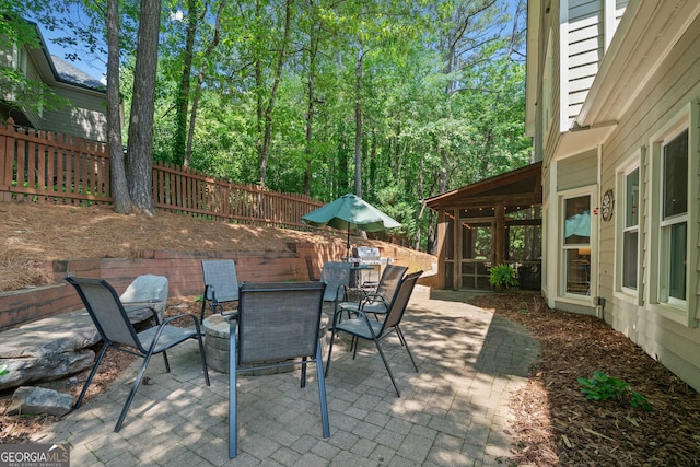 view of patio with a fenced backyard and outdoor dining space