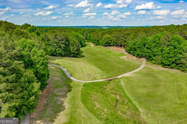 aerial view of a forest and a local golf course