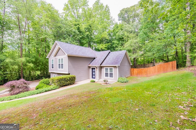 10 Queens Ct, Sharpsburg, GA 30277 - view of front facade with a garage and a shingled roof