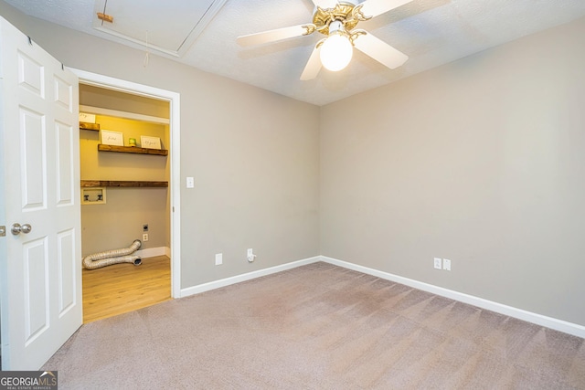 10 Queens Ct, Sharpsburg, GA 30277 - carpeted empty room featuring attic access and a ceiling fan