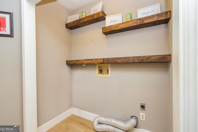 10 Queens Ct, Sharpsburg, GA 30277 - laundry room featuring electric dryer hookup, washer hookup, and wood finished floors