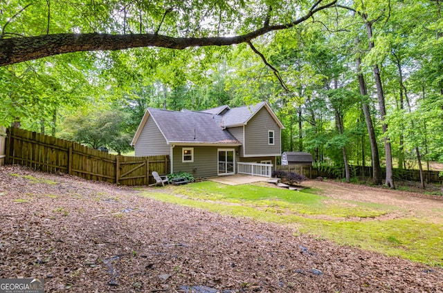 10 Queens Ct, Sharpsburg, GA 30277 - rear view of property featuring roof with shingles