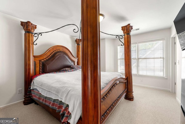 bedroom with carpet floors and baseboards
