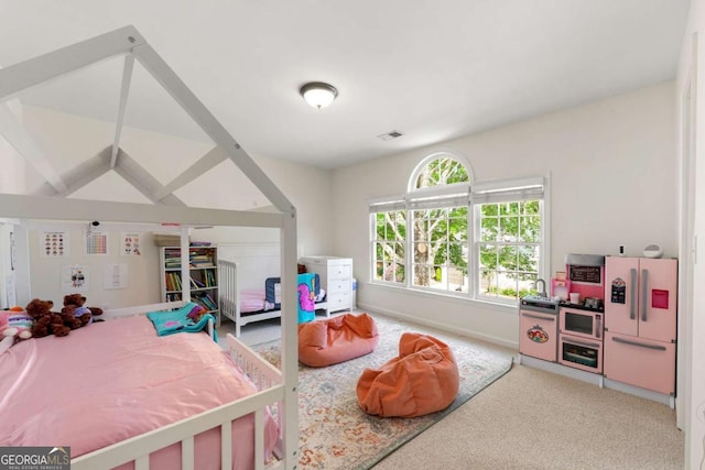 bedroom featuring carpet and baseboards