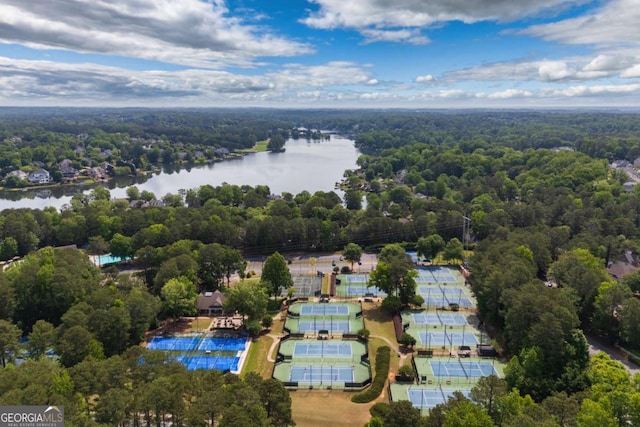 bird's eye view of a large body of water and a heavily wooded area