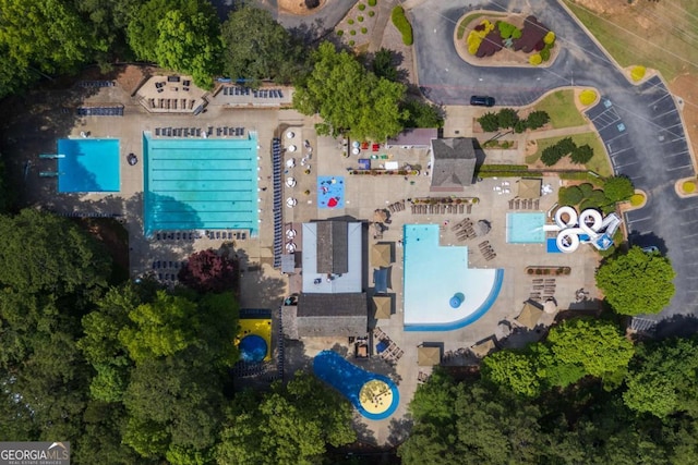 aerial view of property's location with a pool area
