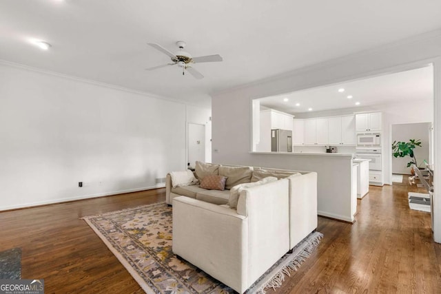 living room featuring ornamental molding, ceiling fan, dark wood-type flooring, and recessed lighting