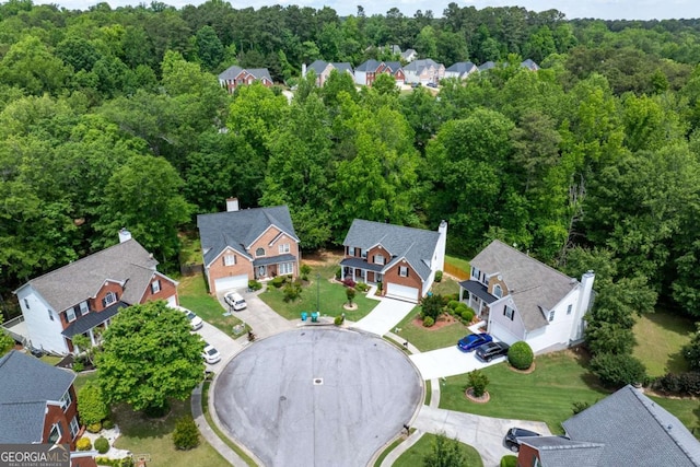 aerial perspective of suburban area with a forest